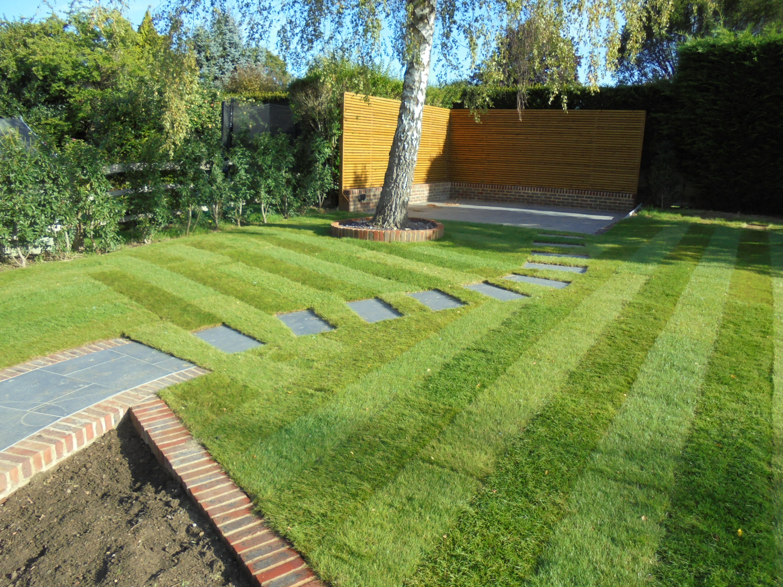 Beautiful landscaped lawn by Sussex Lawns